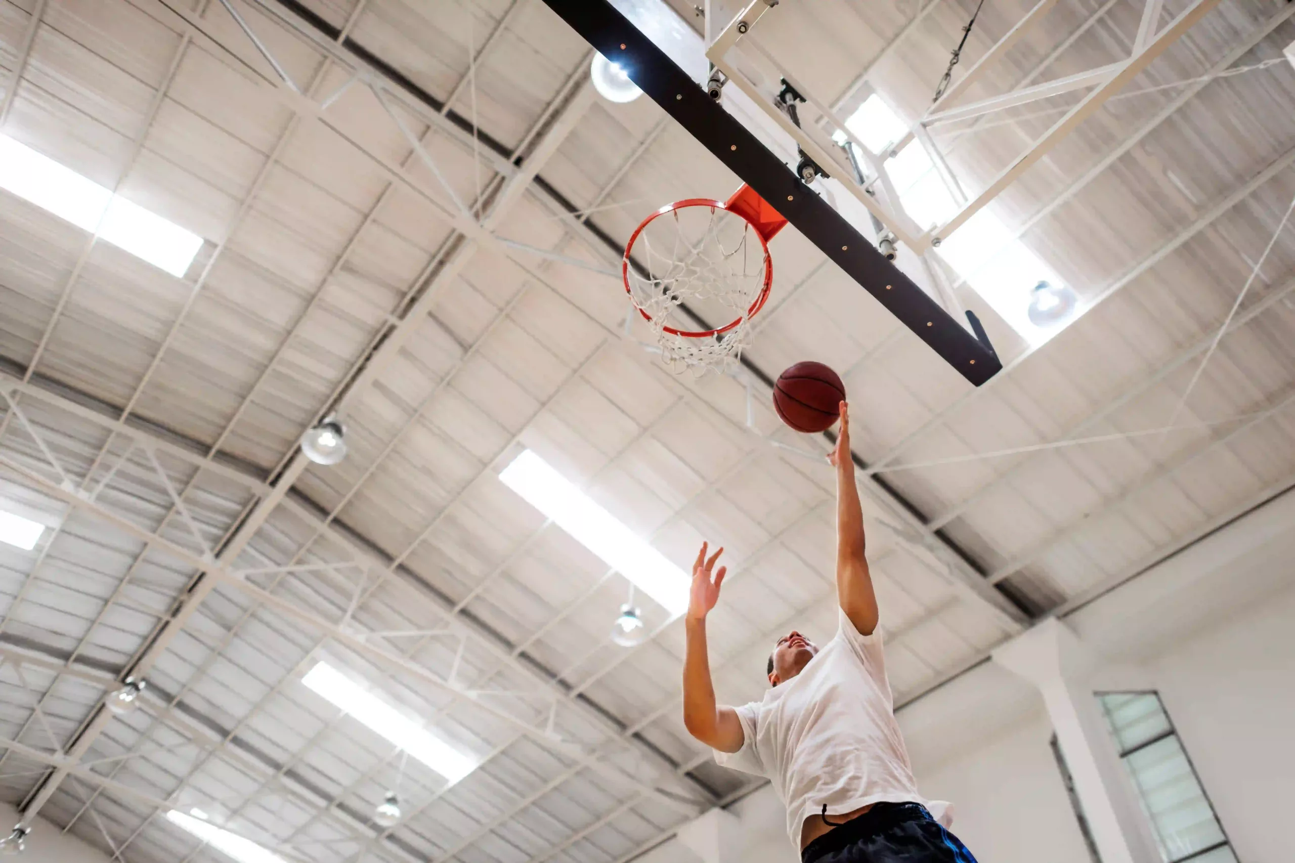 A Gymnasium Equipped With Versatile Led High Bay Lights, Adaptable For Various Events From Sports To Concerts.