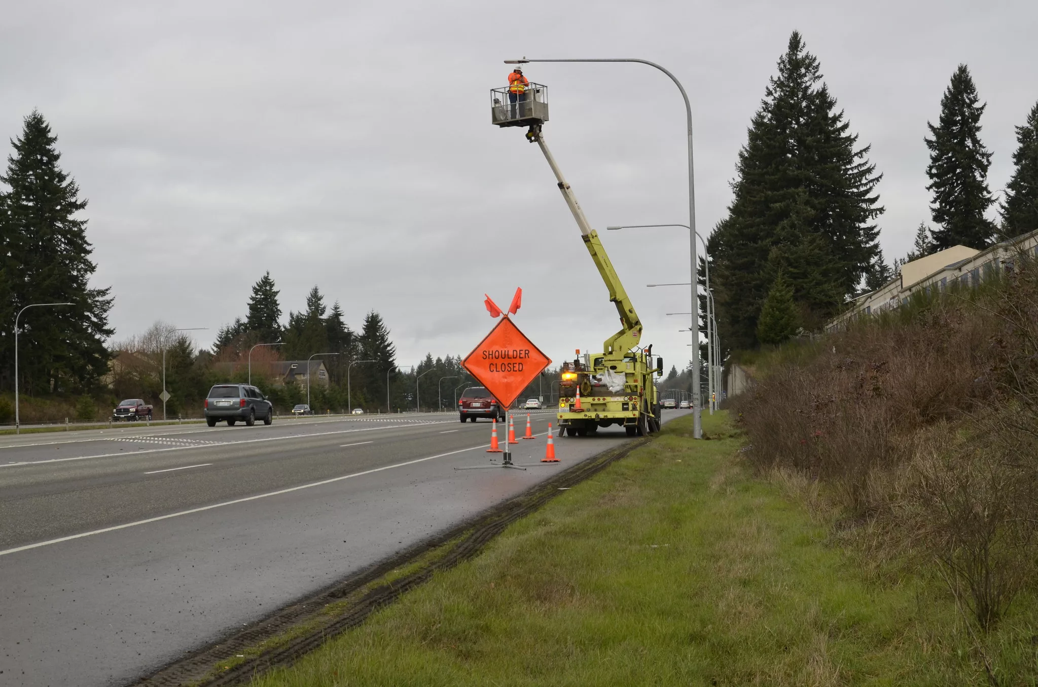 A Photo Of An Outdoor Led Streetlight Being Inspected For Damage